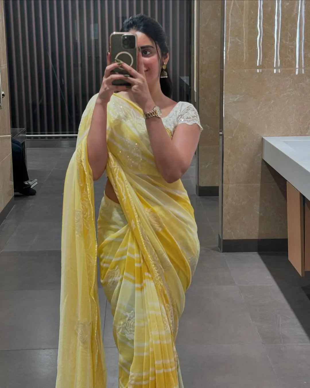 Kushita Kallapu In Traditional Yellow Saree White Blouse